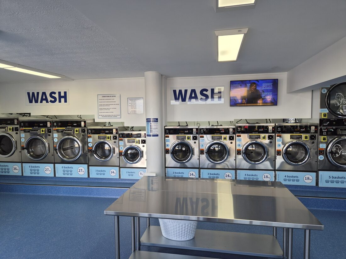 Row of new Dexter front-load washing machines